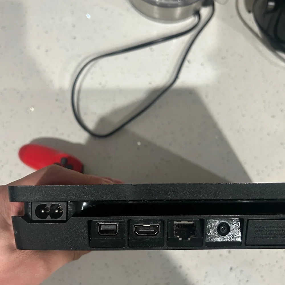 Sony Black Console with Red Controller